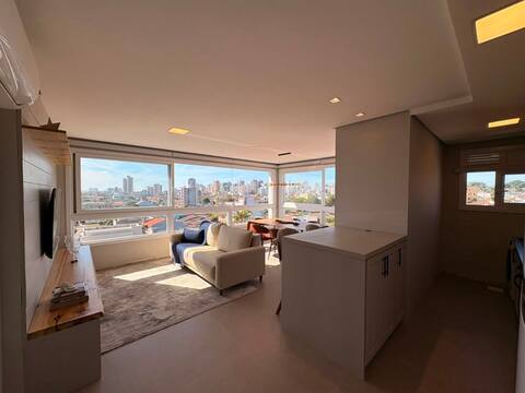 Apartamento 2 dormitórios com 1 suíte e box coberto em Centro, Torres/RS